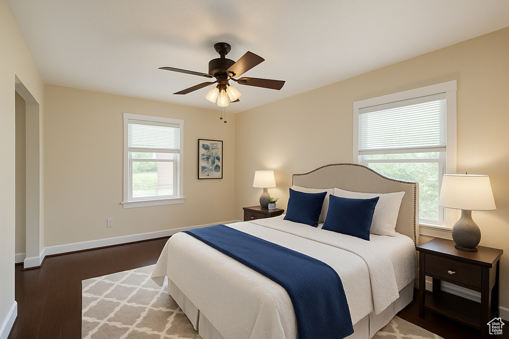Bedroom featuring wood finished floors and a ceiling fan