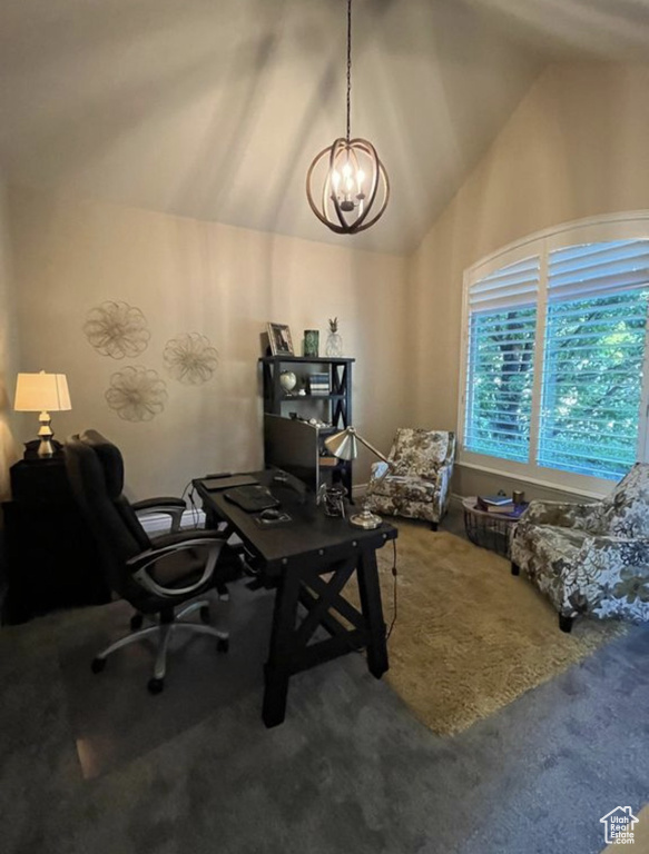 Carpeted office featuring a chandelier and high vaulted ceiling