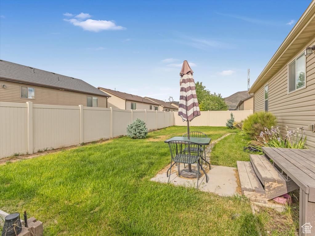Fenced backyard featuring outdoor dining area and a patio area