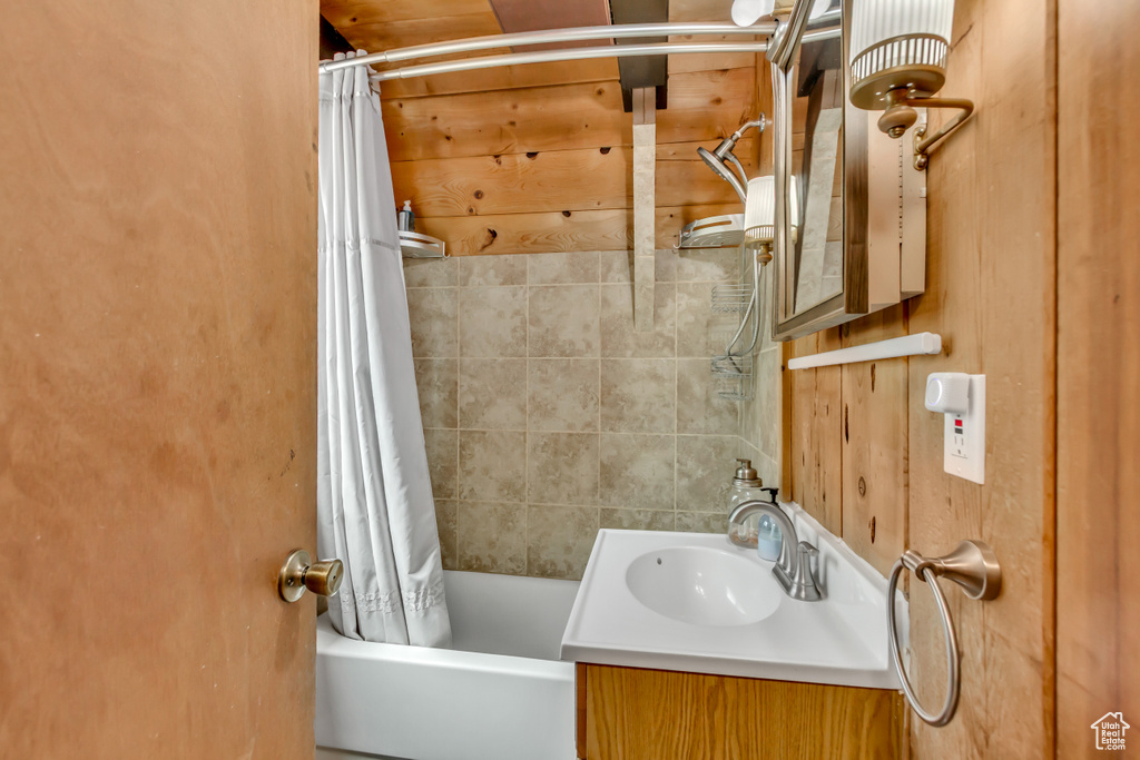 Bathroom featuring vanity and shower / bath combo