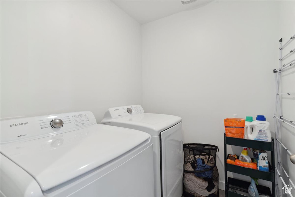 Washroom featuring separate washer and dryer