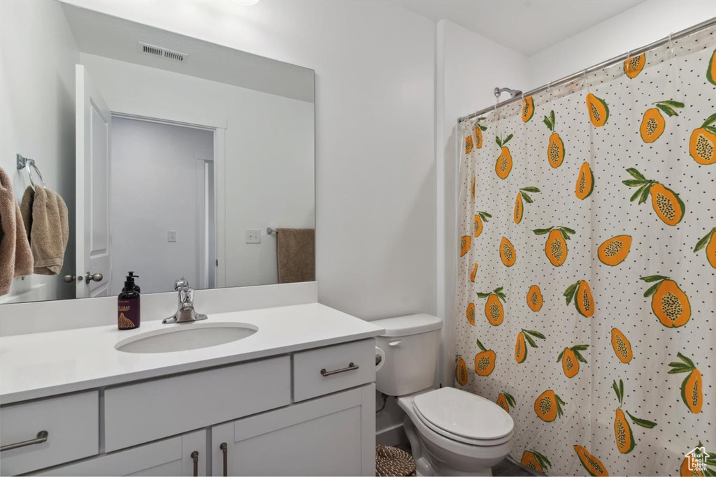 Full bath featuring vanity and a shower with shower curtain