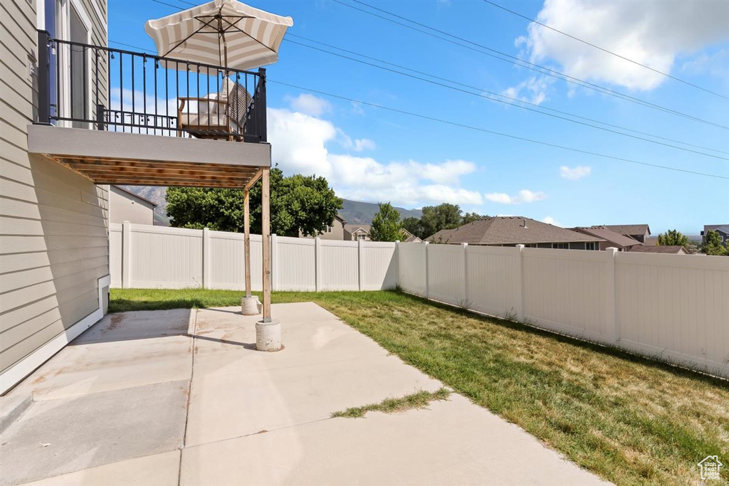 Fenced backyard featuring a patio area