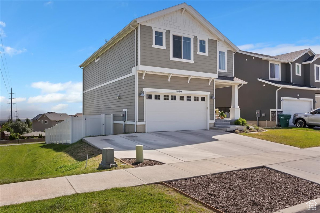 Traditional home with a garage and driveway