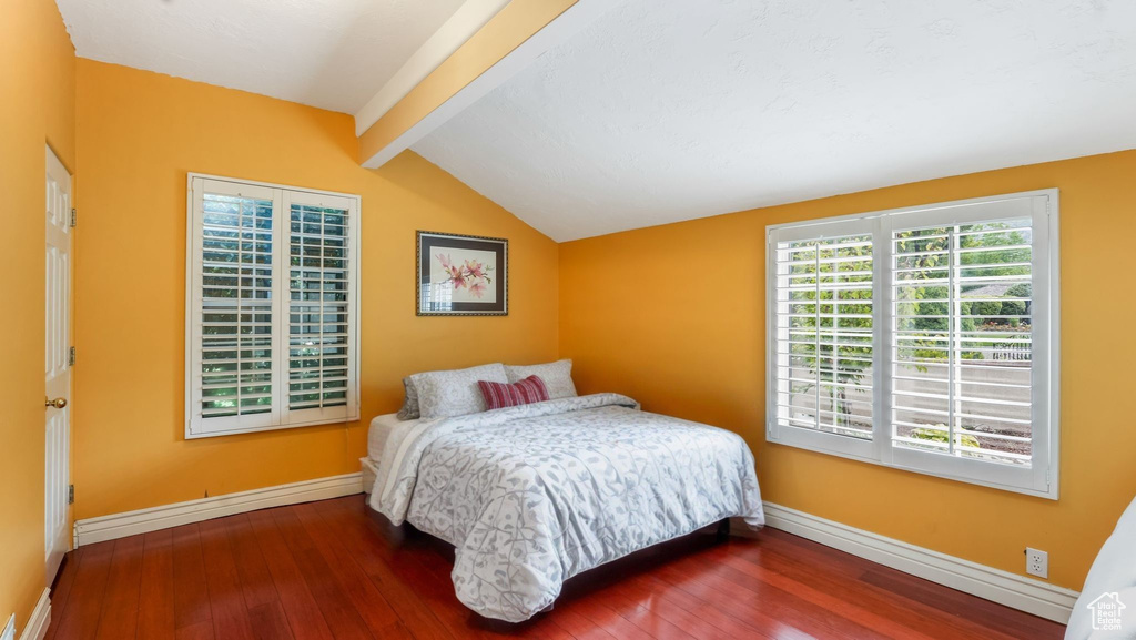 Bedroom with hardwood / wood-style floors