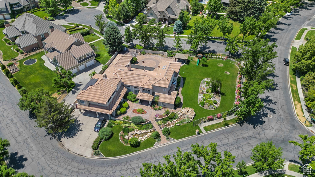 Aerial view of property's location with nearby suburban area