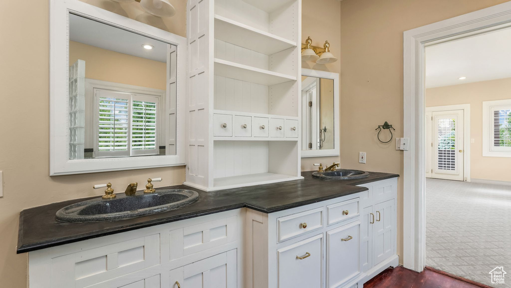 Bathroom with double vanity and plenty of natural light