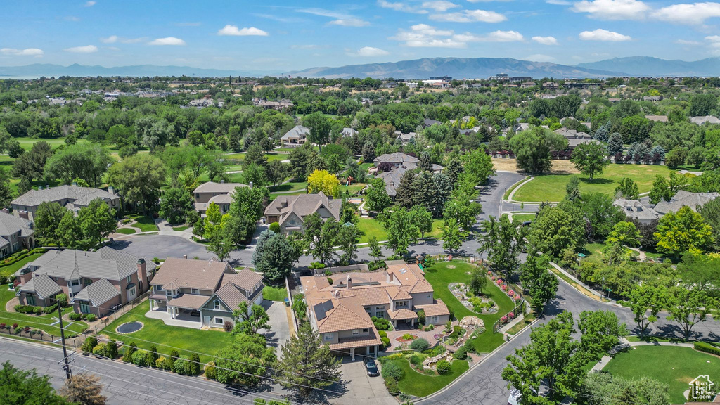 Aerial view of residential area featuring a mountain backdrop