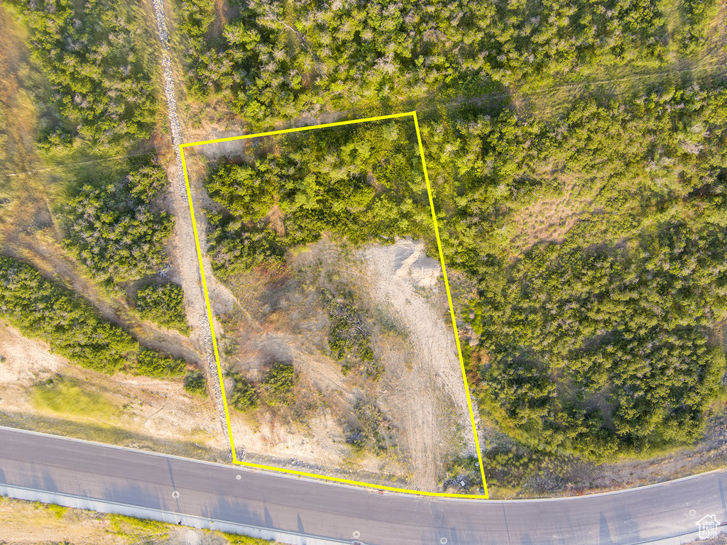 Aerial view of property and surrounding area featuring property parcel outlined