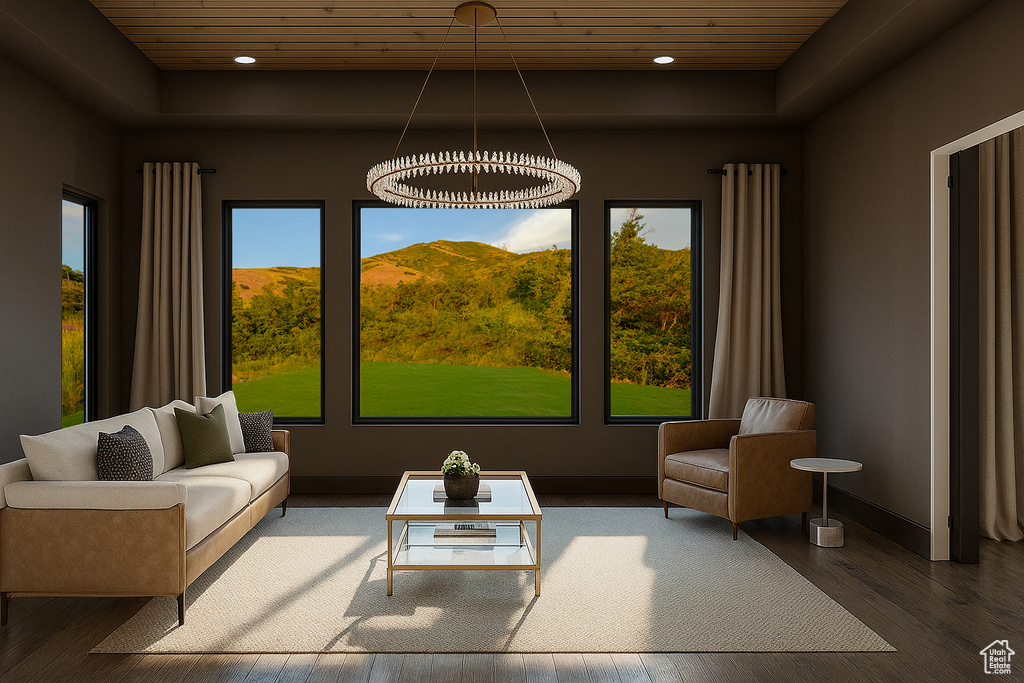 Living area with a tray ceiling, wooden ceiling, wood finished floors, and recessed lighting