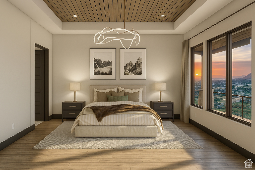 Bedroom with a raised ceiling, a chandelier, wood finished floors, and wood ceiling