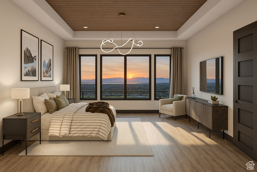 Bedroom with wooden ceiling, a raised ceiling, multiple windows, light wood finished floors, and recessed lighting