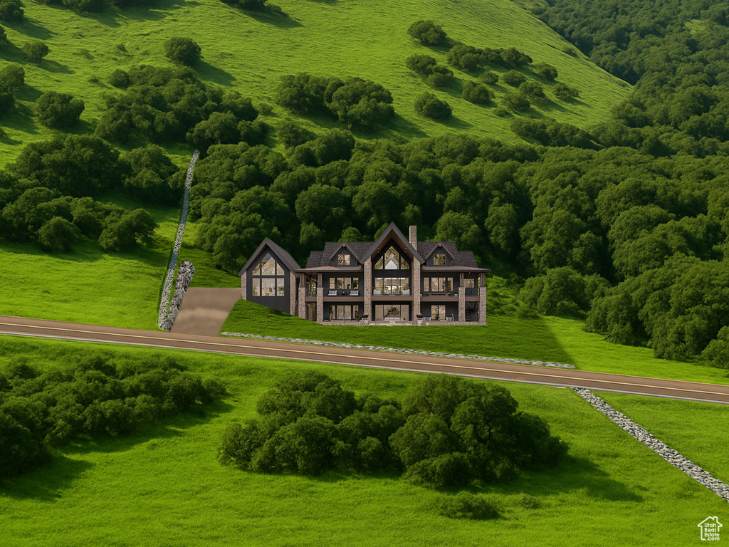 View of subject property featuring a heavily wooded area