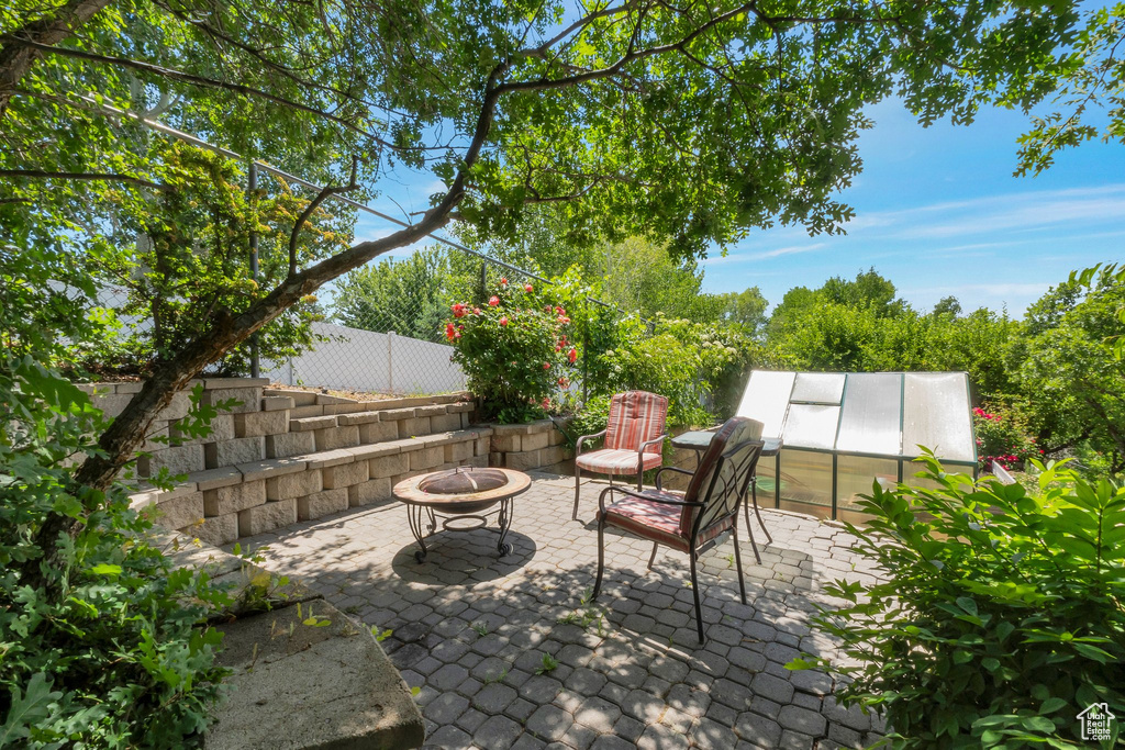 View of patio / terrace with a fire pit