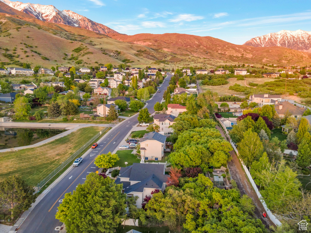 Aerial view of residential area featuring a mountainous background