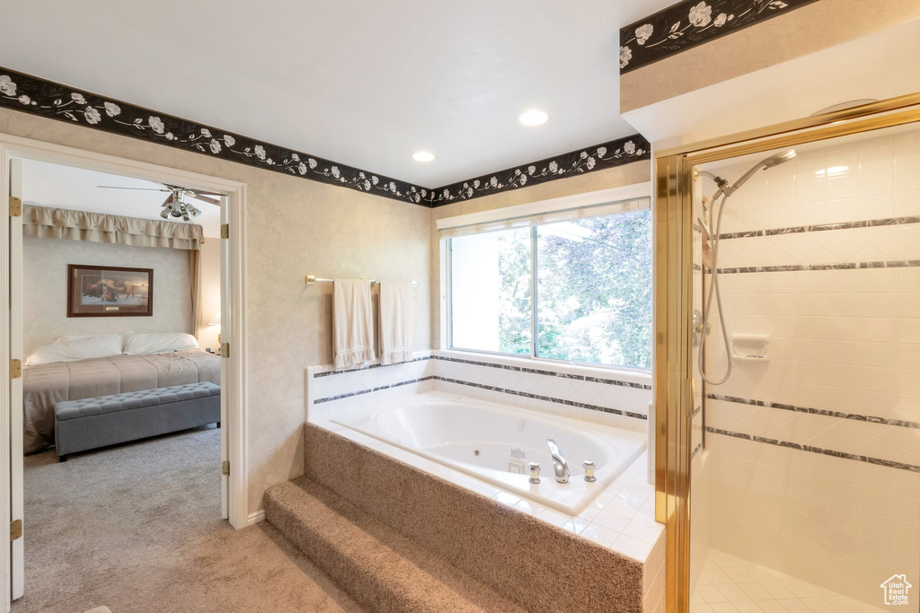 Ensuite bathroom with a jetted tub, a shower stall, and recessed lighting