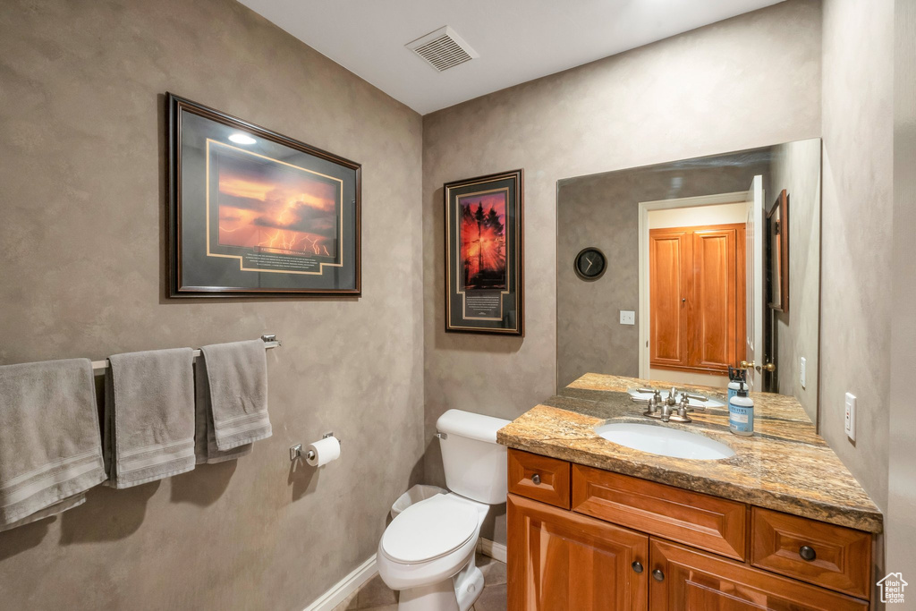 Bathroom with vanity and toilet