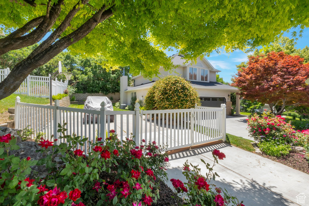 View of front of property with an attached garage and driveway
