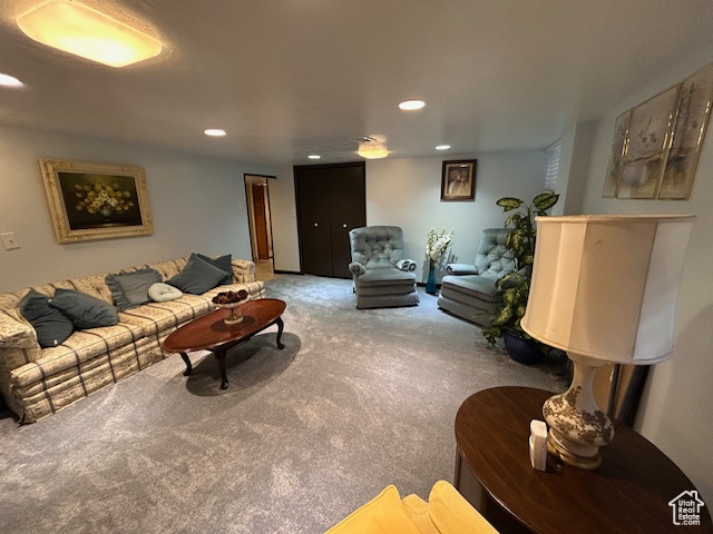 Living area with carpet and recessed lighting