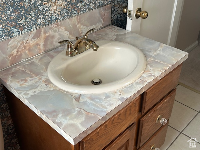 Bathroom view of vanity and baseboards