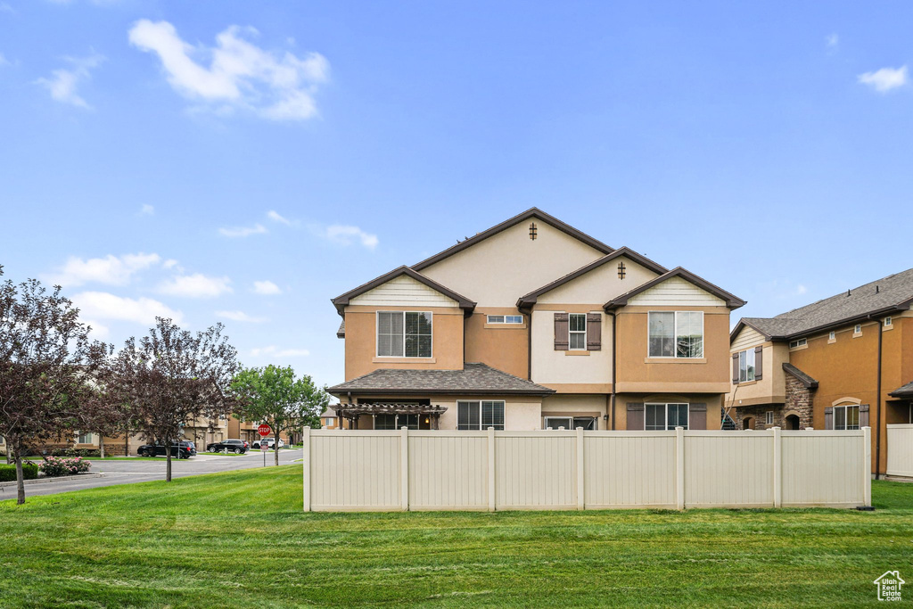 Back of house with stucco siding
