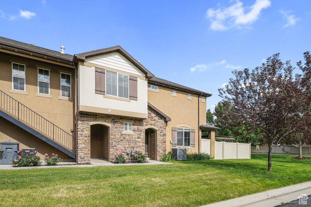 Multi unit property with stucco siding and stone siding