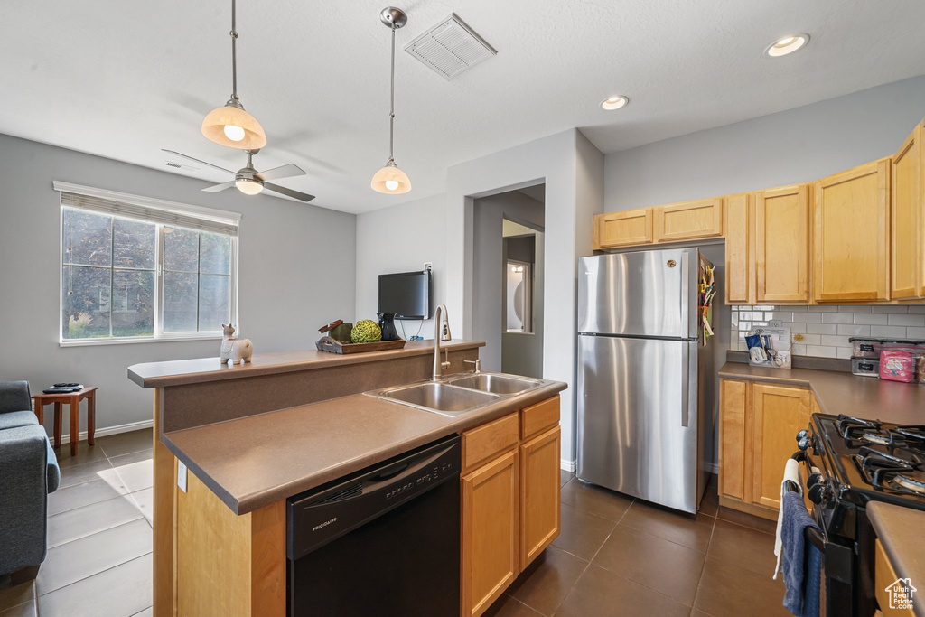 Kitchen with black appliances, backsplash, open floor plan, ceiling fan, and dark tile patterned flooring