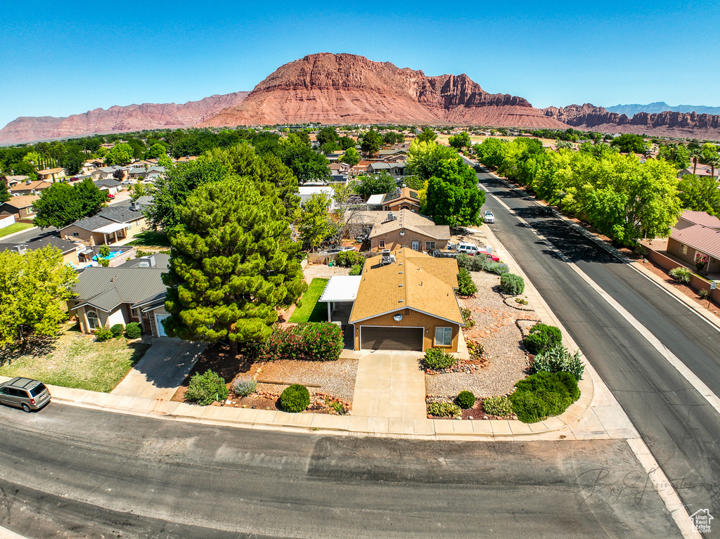 Aerial perspective of suburban area with a mountain backdrop