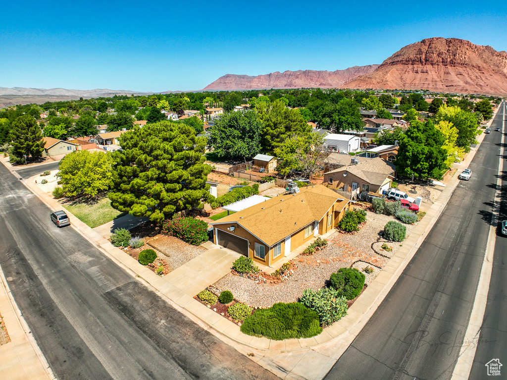 Aerial view of residential area featuring a mountainous background