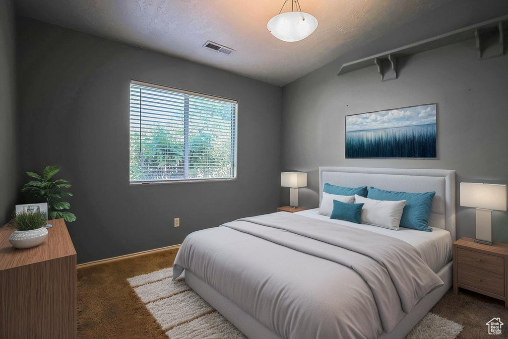 Bedroom with carpet flooring and baseboards