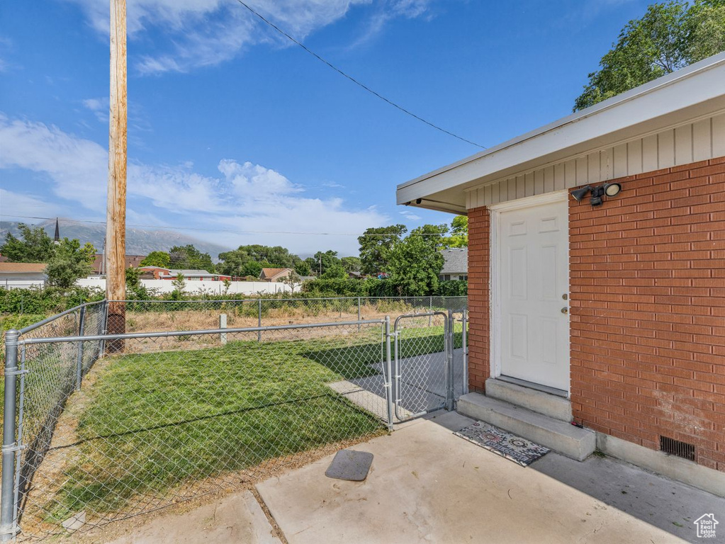 View of yard featuring a gate
