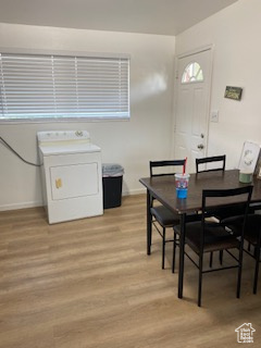 Dining area featuring washer / clothes dryer and light wood-style floors