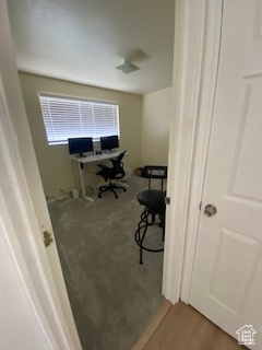 Home office with wood finished floors