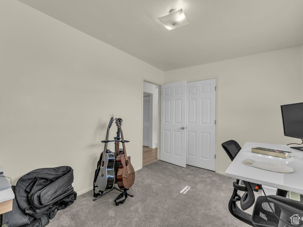 Home office featuring carpet flooring