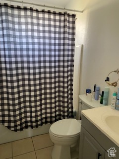 Bathroom with tile patterned floors and vanity