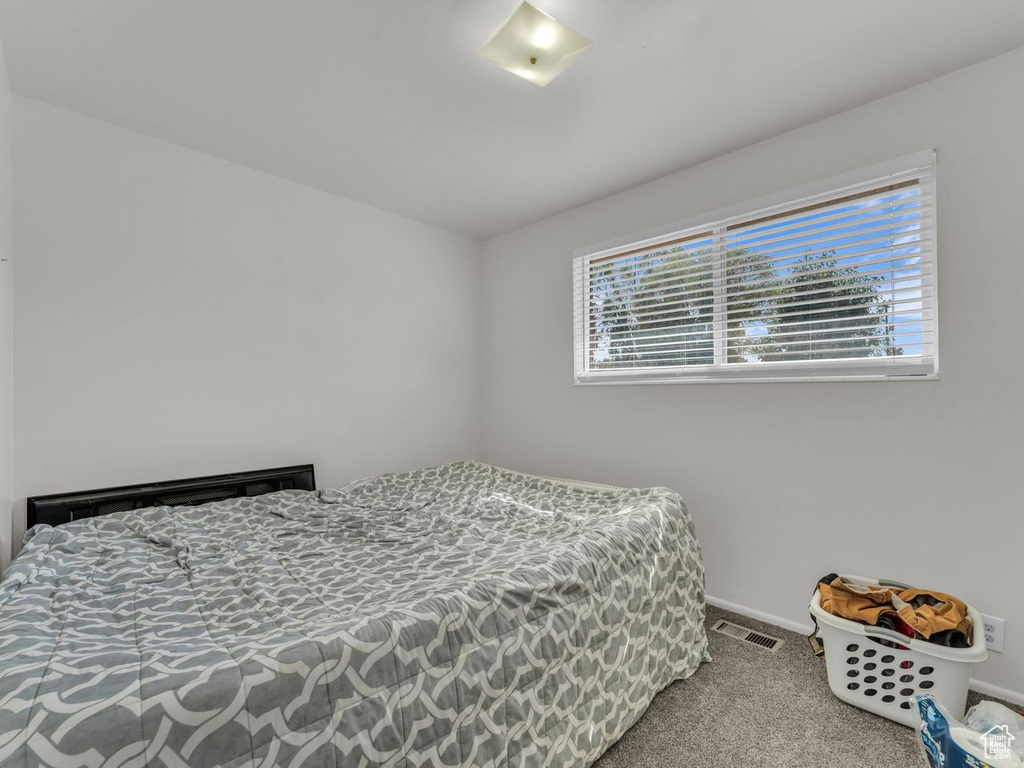 Carpeted bedroom with baseboards