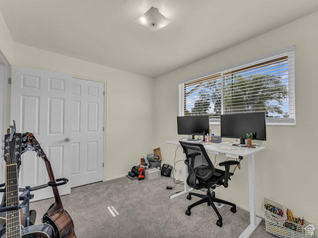 Office space with carpet floors and baseboards
