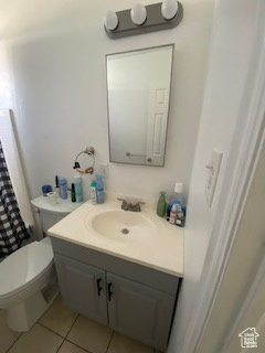 Bathroom with vanity and tile patterned floors