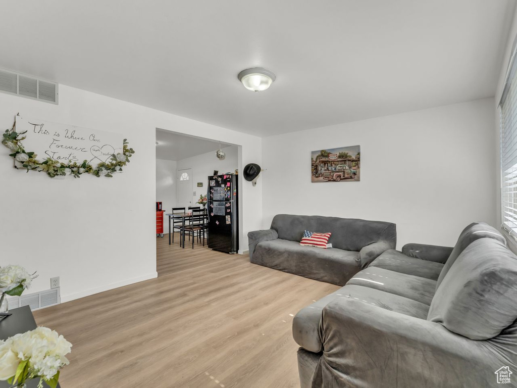 Living room featuring wood finished floors and baseboards