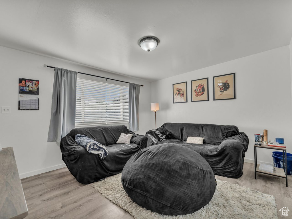 Living room with wood finished floors and baseboards