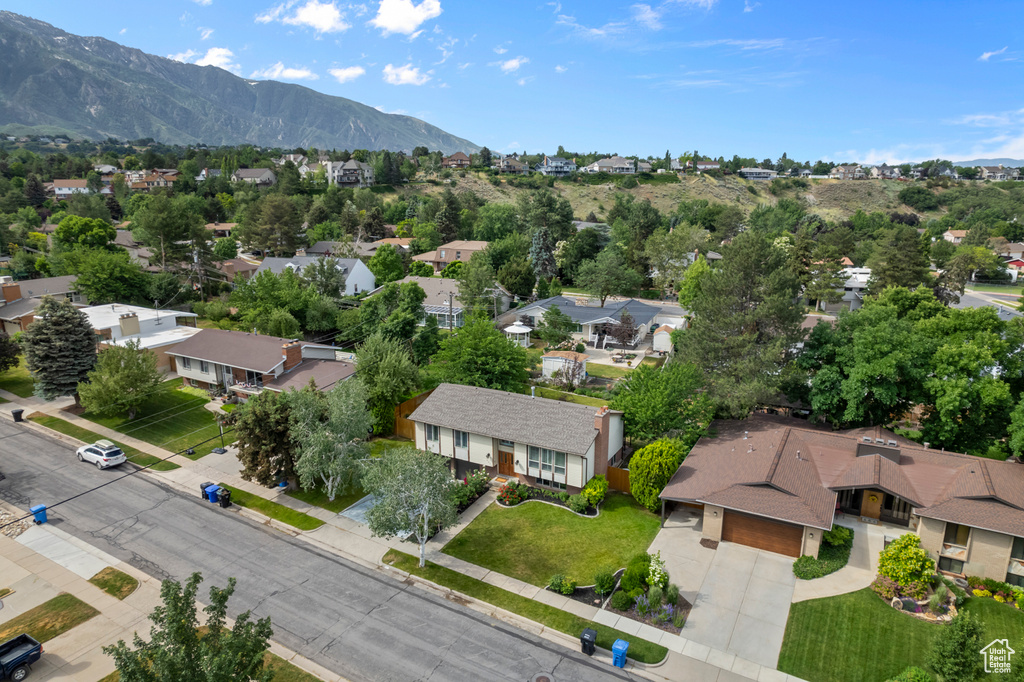 Aerial perspective of suburban area with a mountain backdrop