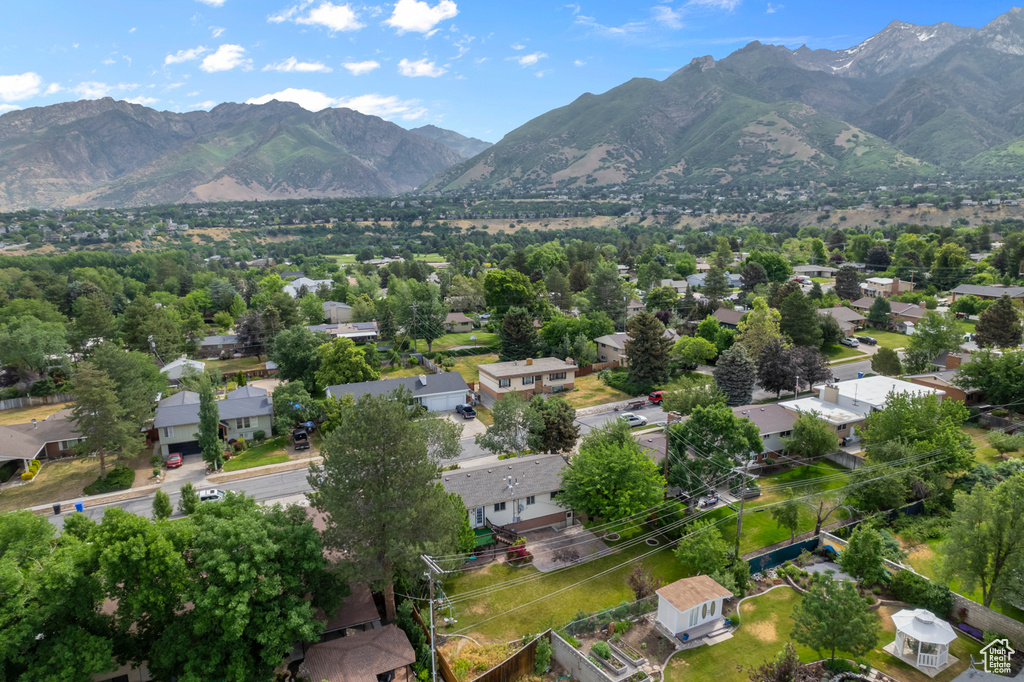 Aerial perspective of suburban area featuring a mountainous background