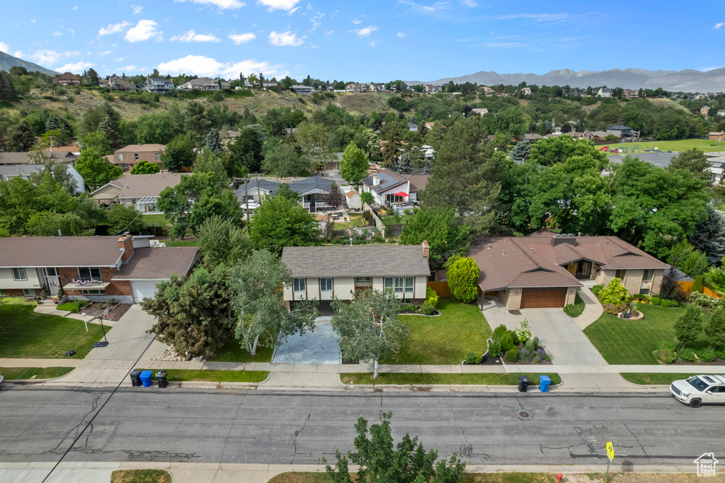 Aerial view of residential area featuring a mountain backdrop