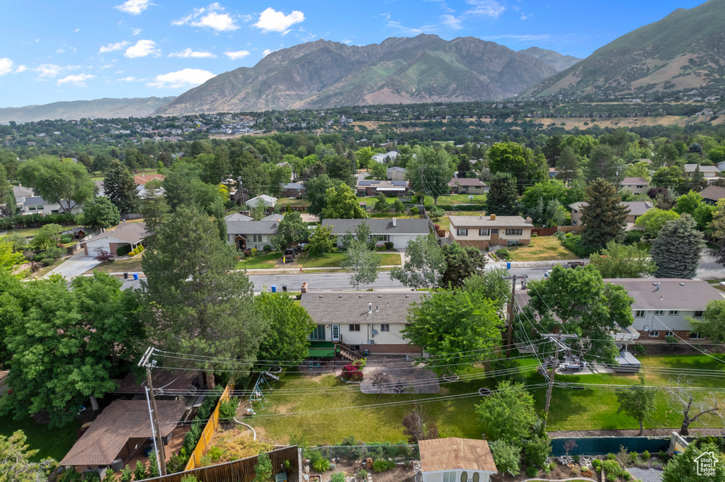 Aerial perspective of suburban area with a mountainous background