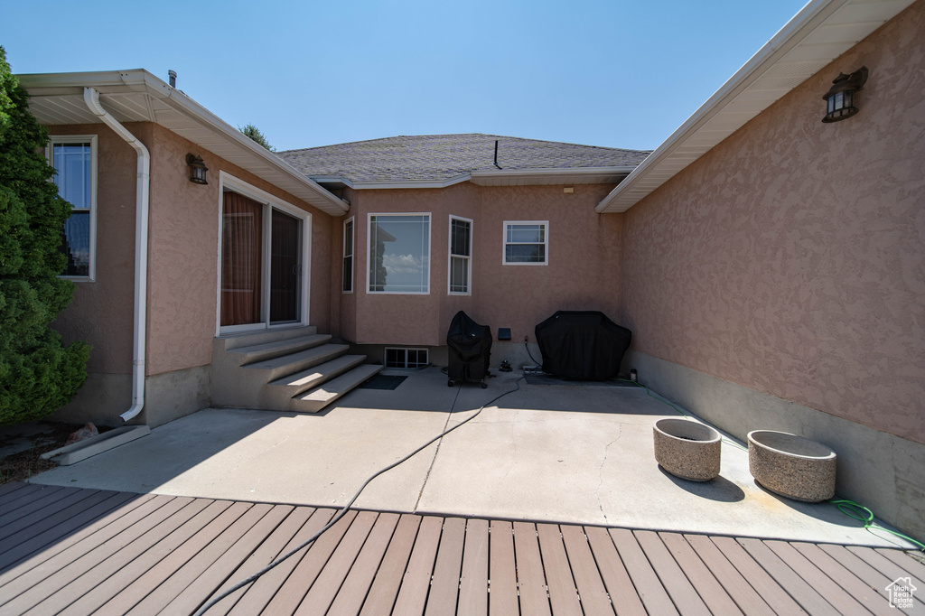 Deck featuring entry steps and a patio