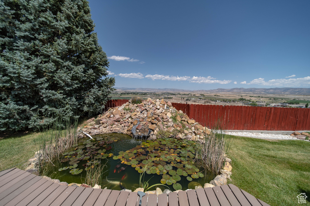 Deck featuring a garden pond