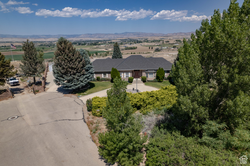 View of subject property featuring mountains