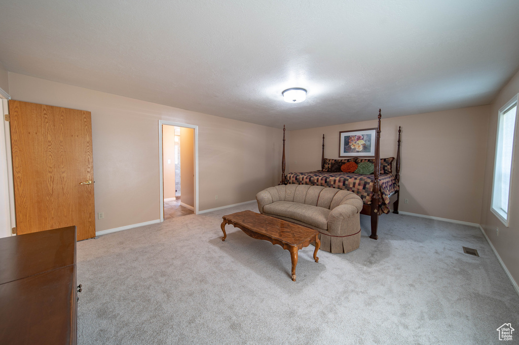 Carpeted bedroom featuring baseboards