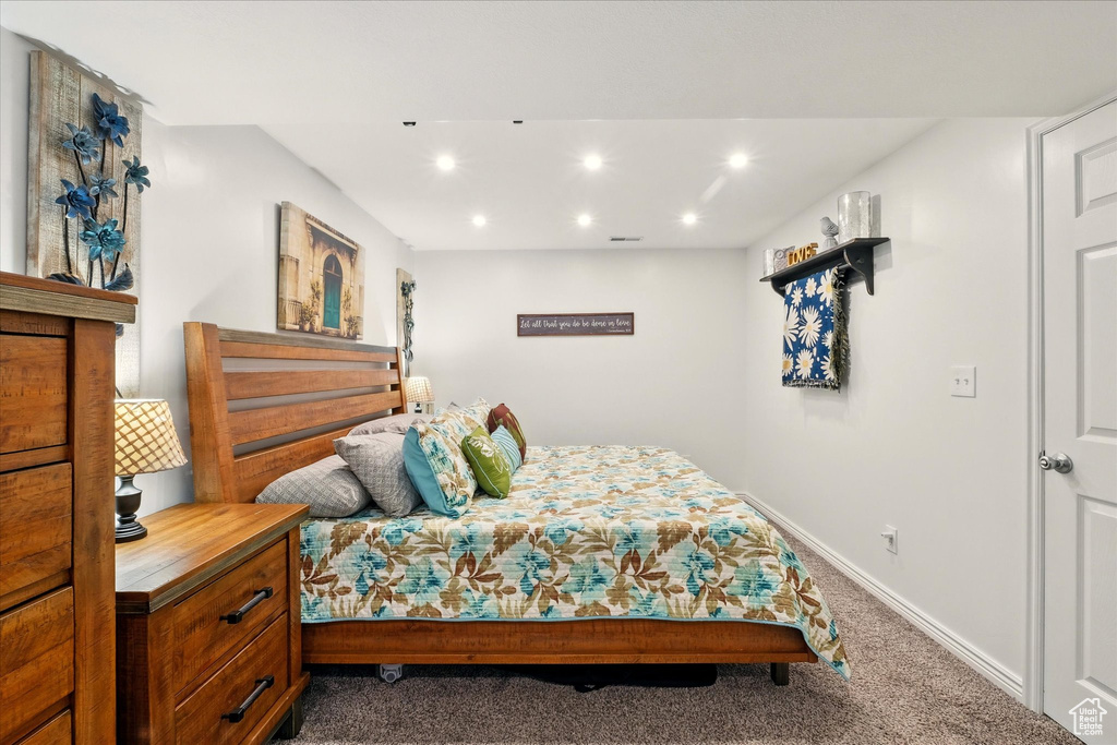Bedroom featuring dark colored carpet and recessed lighting