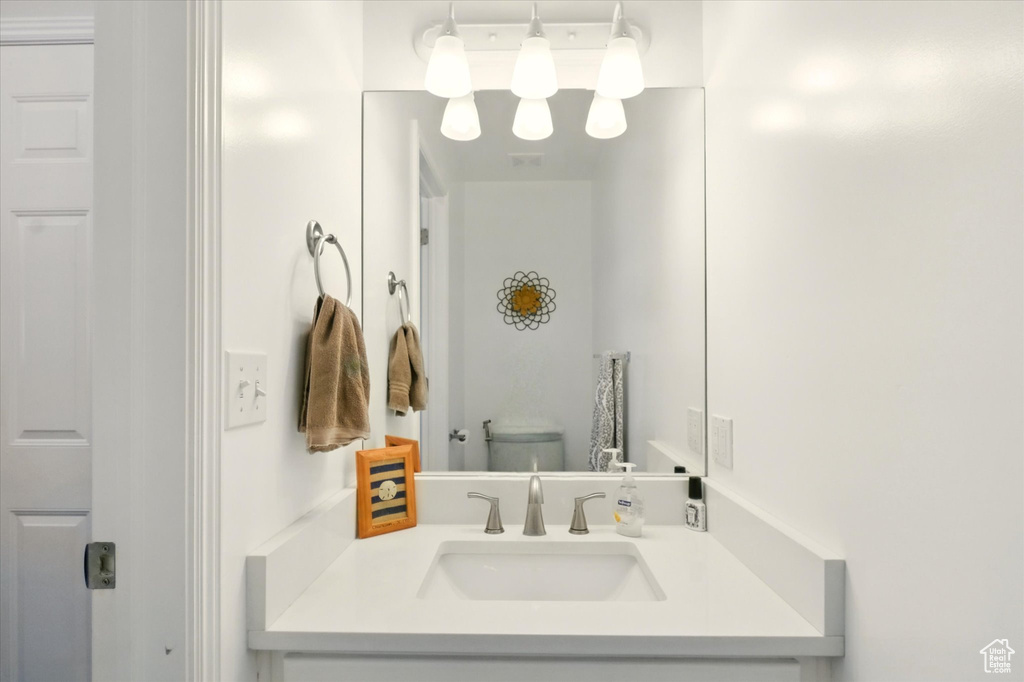 Bathroom featuring vanity and toilet